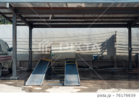Empty car wash or car care with track car ramp in station 76176639