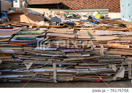 Pile of folded cardboard and paper box stored for recycle Pile of folded cardboard and paper box stored for recycle 76176706