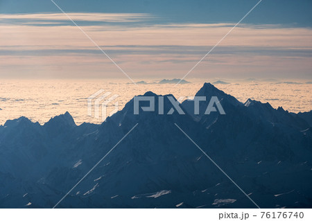 Above of peaked mountain range with cloudy in the morning 76176740