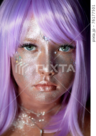 A girl with purple hair and glowing skin. An alien or a fairy with glowing skin. A girl with purple hair and glowing skin. An alien or a fairy with glowing skin. 76177501