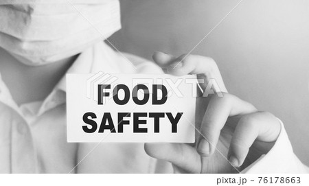 Doctor holding a card with text Food Safety, medical concept Doctor holding a card with text Food Safety, medical concept 76178663