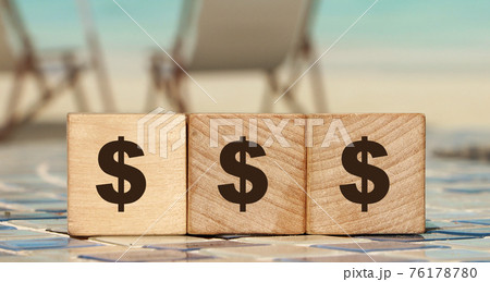 Money saving and saving concept - wooden cubes with dollar sign. Close up. Money saving and saving concept - wooden cubes with dollar sign. Close up. 76178780