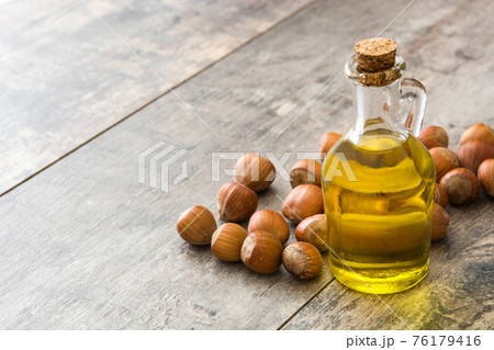 Hazelnuts oil on wood Hazelnuts oil on wood 76179416