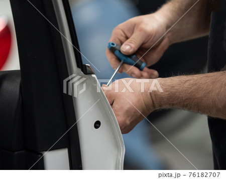 Repairing dents in a car Repairing dents in a car 76182707