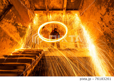 Fire painting at cold winter at night 76183261