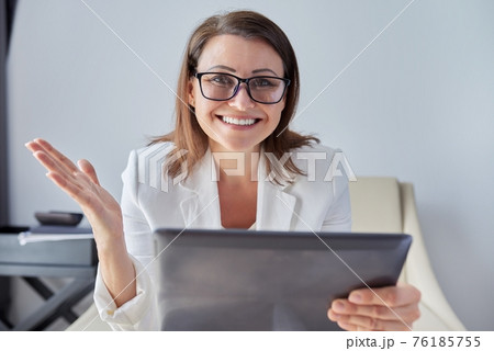 Woman teacher, mentor, psychologist looking at webcam, talking, counseling Woman teacher, mentor, psychologist looking at webcam, talking, counseling 76185755