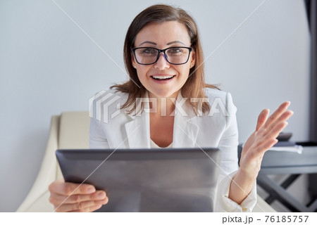 Female mentor, tutor, teacher looking at webcam, closeup face Female mentor, tutor, teacher looking at webcam, closeup face 76185757