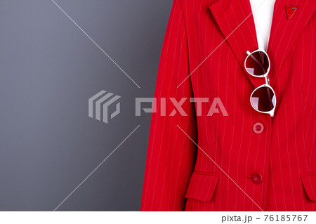 Women elegant blazer, sunglasses and copy space. Women elegant blazer, sunglasses and copy space. 76185767