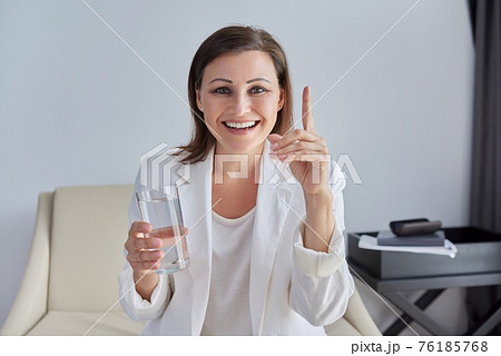 Video conference, specialist talking, counseling, helping patient online, holding glass of water Video conference, specialist talking, counseling, helping patient online, holding glass of water 76185768