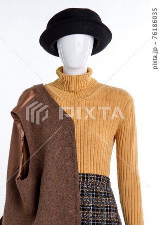 Stylish warm winter clothing on mannequin. Stylish warm winter clothing on mannequin. 76186035