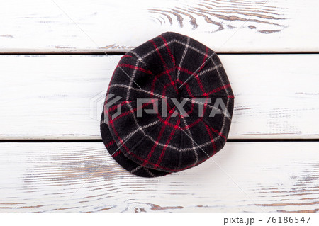 Dark checkered woolen hat. 76186547