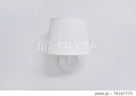 White elegant modern wall lamp with textile shade in interior White elegant modern wall lamp with textile shade in interior 76187775