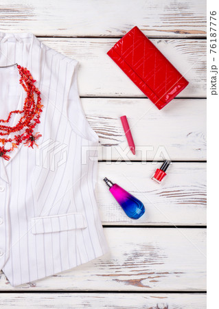 Flat lay white women's jacket and accessories. Flat lay white women's jacket and accessories. 76187776