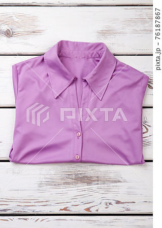 Folded purple women shirt. Folded purple women shirt. 76187867