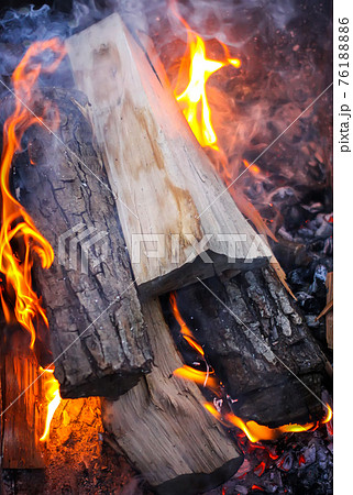Bright flame of wood burning in brazier during the preparation for cooking on barbecue. Bright flame of wood burning in brazier during the preparation for cooking on barbecue. 76188886