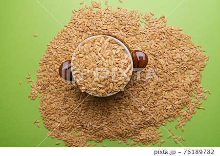Melon seeds. Melon seeds on a green background Melon seeds. Melon seeds on a green background 76189782