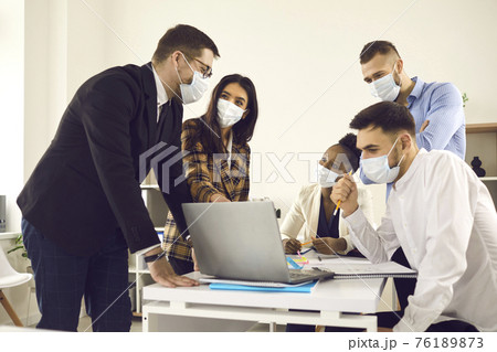 Creative business team meeting after lockdown in new normal safe office Creative business team meeting after lockdown in new normal safe office 76189873