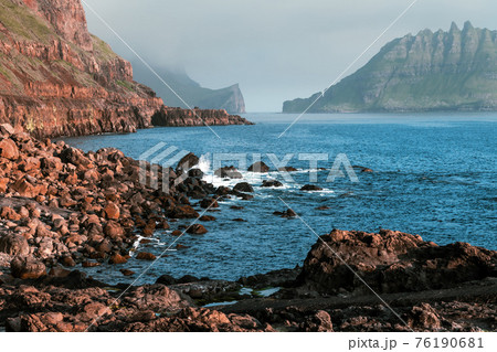 Dramatic view on Drangarnir and Tindholmur sea stacks Dramatic view on Drangarnir and Tindholmur sea stacks 76190681