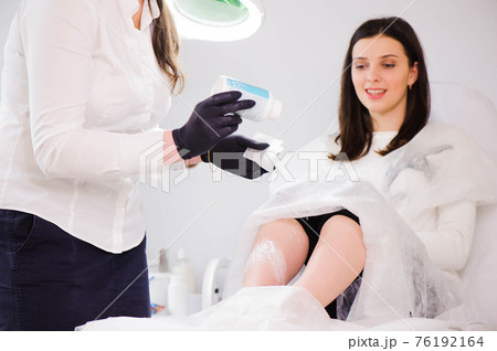 process of legs depilation by sugar for women in beauty salon. process of legs depilation by sugar for women in beauty salon. 76192164