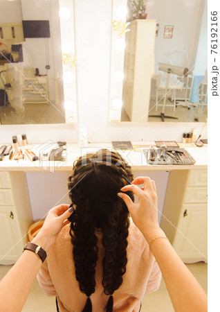 Beautiful woman getting haircut by hairdresser in the beauty salon. 76192166