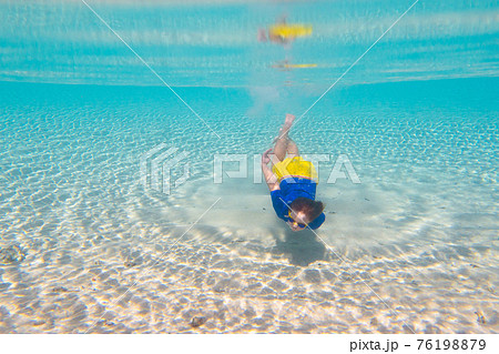 Child snorkeling. Kids underwater. Beach and sea. Child snorkeling. Kids underwater. Beach and sea. 76198879