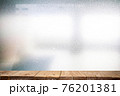 Wood plank table top on abstract backgrounds, characteristics of the light strikes the surface, causing noise and grain texture 76201381