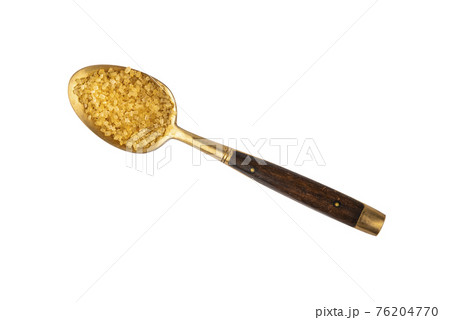 Vintage golden spoon full of brown cane sugar 76204770
