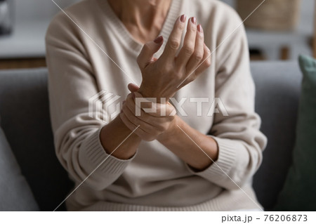 Middle aged elderly woman feeling wrist pain 76206873