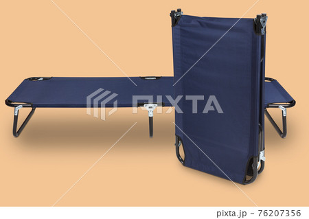 two blue clamshells for camping, on a pastel colored background, travel concept two blue clamshells for camping, on a pastel colored background, travel concept 76207356