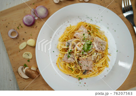 spaghetti carbonara served on wooden table lunch dinner. spaghetti carbonara served on wooden table lunch dinner. 76207563