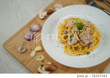 spaghetti carbonara served on wooden table lunch dinner. spaghetti carbonara served on wooden table lunch dinner. 76207564