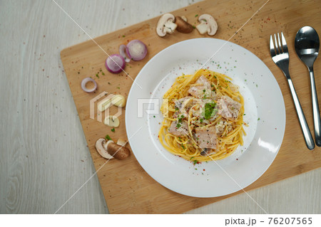 spaghetti carbonara served on wooden table lunch dinner. spaghetti carbonara served on wooden table lunch dinner. 76207565