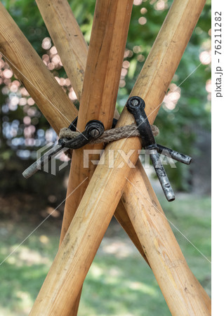 crossed wooden poles connect together the base of the tent crossed wooden poles connect together the base of the tent 76211282