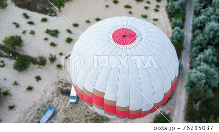 Aerial view of a hot-air balloon in Cappadocia Aerial view of a hot-air balloon in Cappadocia 76215037