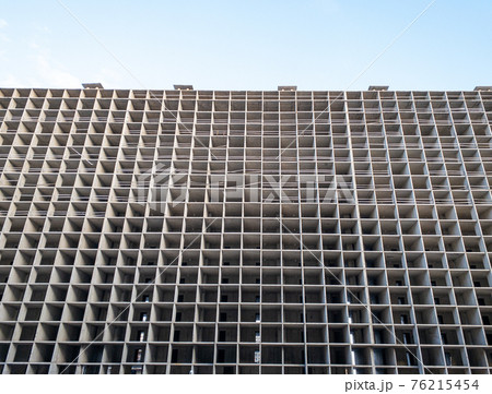 High-rise unfinished apartment building. 76215454