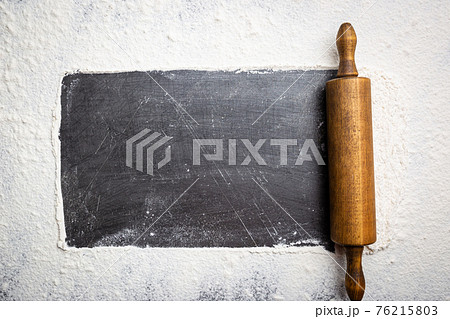 Rolling pin and white flour Rolling pin and white flour 76215803
