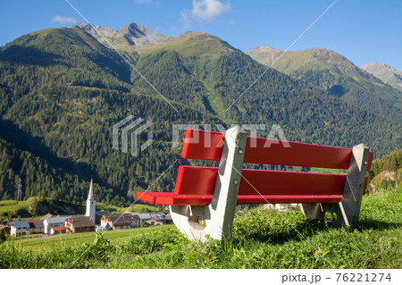 Bench overlooking Engadin Valley in Swiss Alps 76221274