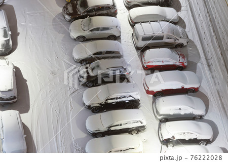 Cars on night winter parking lots Cars on night winter parking lots 76222028