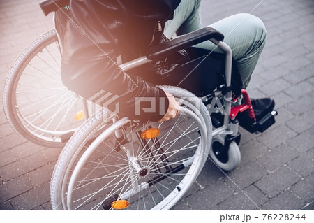 Close up of disabled man on wheelchair. Close up of disabled man on wheelchair. 76228244