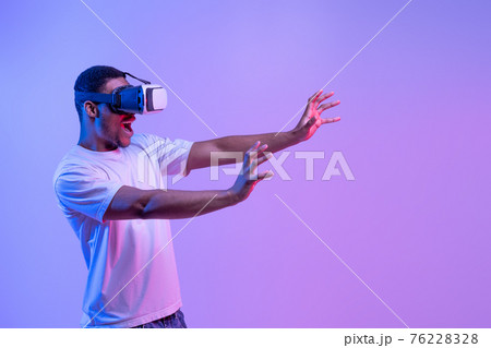 Modern Technologies For Entertainment. Portrait Of amazed black man In VR headset 76228328