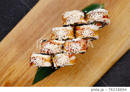 Seafood delicatessen unagi sushi rolls on board Seafood delicatessen unagi sushi rolls on board 76228894