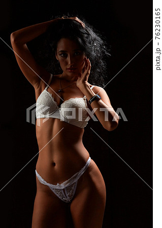 Art nude. Perfect body, sexy girl on the black background Art nude. Perfect body, sexy girl on the black background 76230165