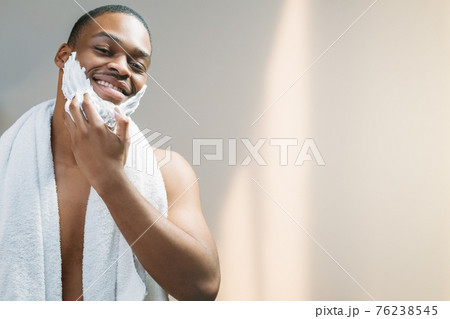 male skincare man applying shaving foam on face 76238545
