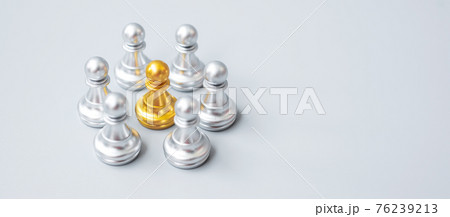 golden chess pawn pieces or leader leader businessman with circle of silver men. leadership, business, team, and teamwork concept golden chess pawn pieces or leader leader businessman with circle of silver men. leadership, business, team, and teamwork concept 76239213