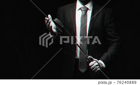 male dominant holds a leather whip Flogger for hard BDSM sex male dominant holds a leather whip Flogger for hard BDSM sex 76240889