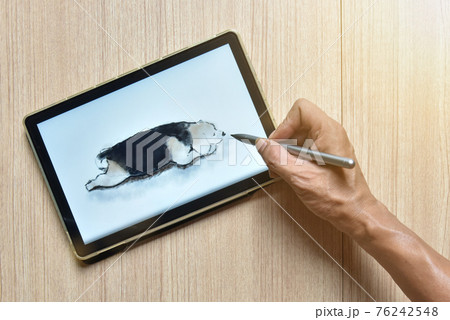 a tablet showing hand sketch the drawing of beagle dog with digital pens on wood table, the concept of new technology for drawing and rendering of tablet with digital pen a tablet showing hand sketch the drawing of beagle dog with digital pens on wood table, the concept of new technology for drawing and rendering of tablet with digital pen 76242548