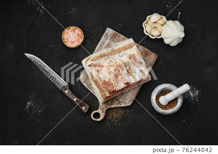 Overhead view of salted with caraway pork belly lard Overhead view of salted with caraway pork belly lard 76244042