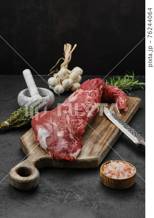 Raw beef tri-tip loin on cutting board 76244064