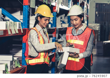 Female warehouse worker working at the storehouse Female warehouse worker working at the storehouse 76245907