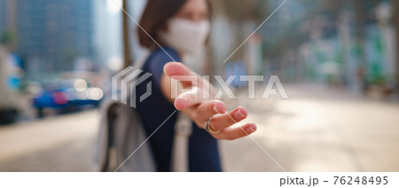 Portrait of young woman wearing in blue dress and white mask Portrait of young woman wearing in blue dress and white mask 76248495